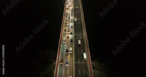 4K Aerial Top Drone View: Accident and traffic jam on the bridge in the evening after a working day. A huge number of cars on the road at rush hour. Downtown, city central part.