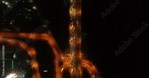 4K Aerial Top Drone View: Accident and traffic jam on the bridge in the evening after a working day. A huge number of cars on the road at rush hour. Downtown, city central part. Dnipro, Ukraine