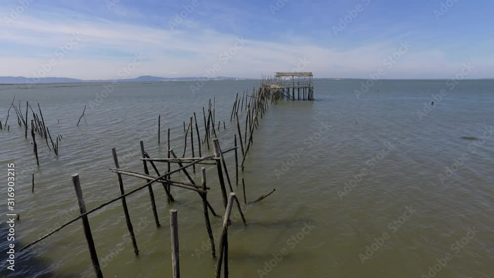 Old wooden fishing port with low tide carrasqueira portugal 4k Old wooden fishing port with low tide carrasqueira portugal 4k