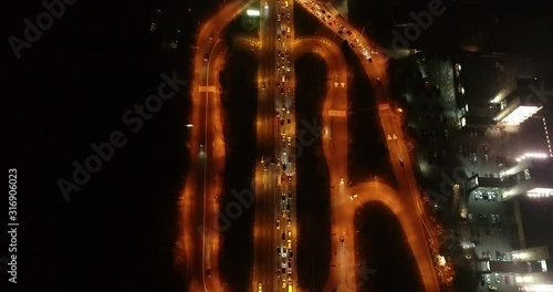4K Aerial Top Drone View: Accident and traffic jam on the bridge in the evening after a working day. A huge number of cars on the road at rush hour. Downtown, city central part. Camera looks down.