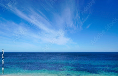 open ocean with blue sky