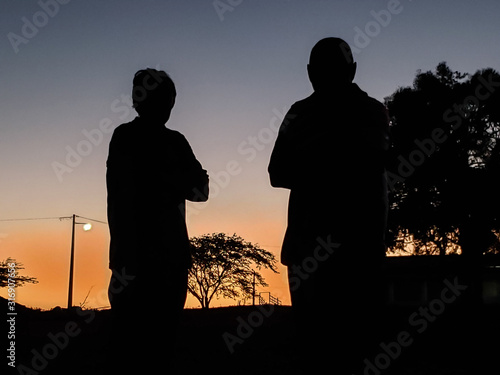 silhouette of a man with his son