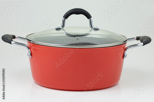 Принти на полотні Red non-stick cooking pot with a tempered glass lid and side handles, isolated o