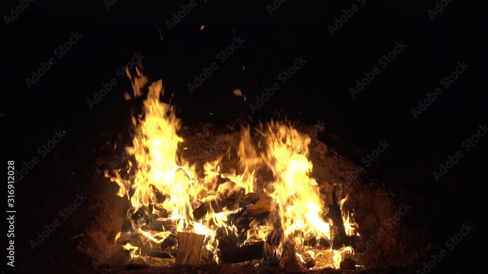 A bonfire or campfire burning in the night. A bonfire or campfire burning in the night.