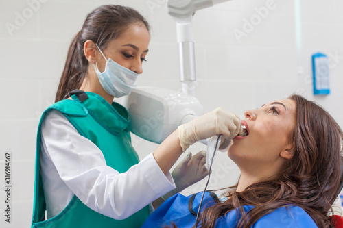 Dentist x-ray. A woman having her teeth x-rayed