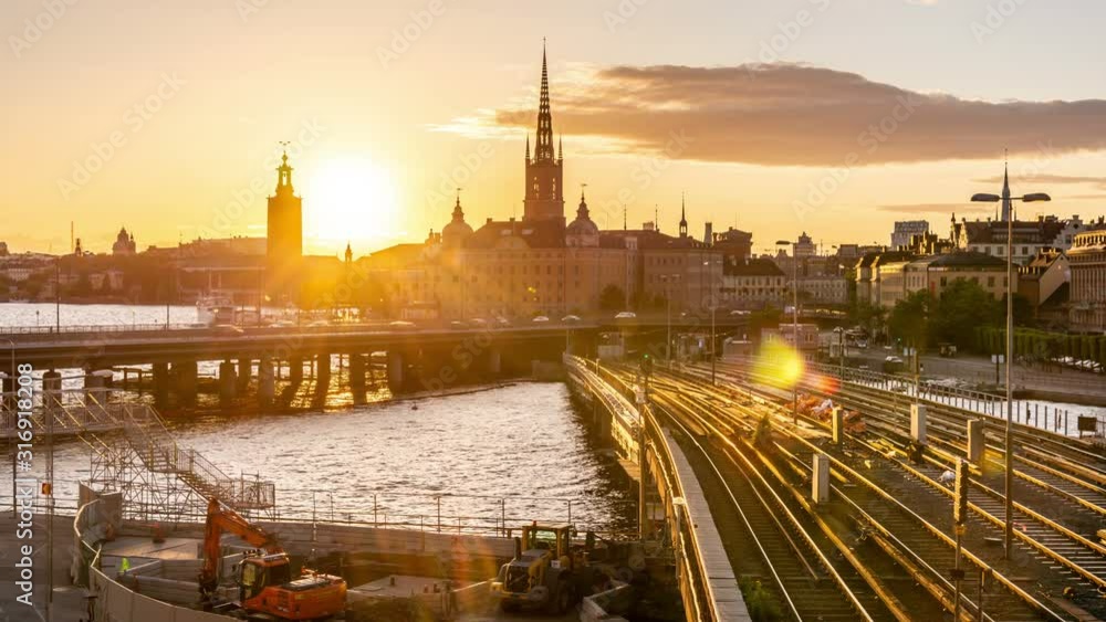 Sunset in Stockholm, Sweden. Time lapse video. Stockholm city skyline with Centralbron seen from Sodermalm district.