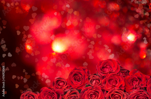 Bouquet of red roses on Glowing Hearts. Heart Shape Bokeh. Birthday. Valentine s day. March 8. Mother s day. Greeting card. Wallpaper. Banner.