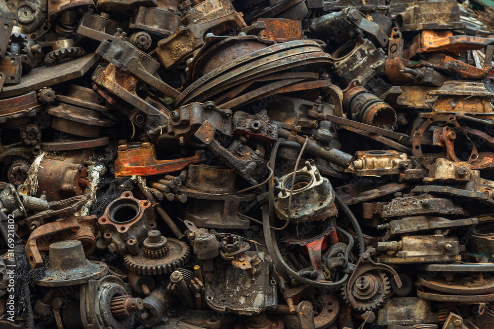 Close up pattern of division of dirty used automobile parts for background.
