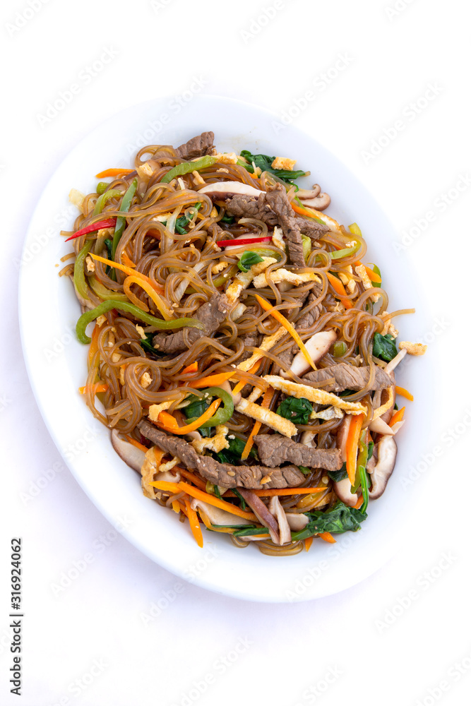 Stir fried Korean glass noodle with soy sauce called Japchae Stir fried Korean glass noodle with soy sauce called Japchae