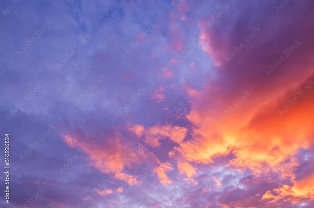 Beautiful red vibrant burning sunset sky with clouds Beautiful red vibrant burning sunset sky with clouds