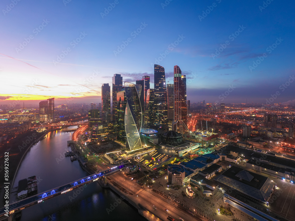 Moscow city sunset aerial view from drone with scyscrappers, business centre and ambankment