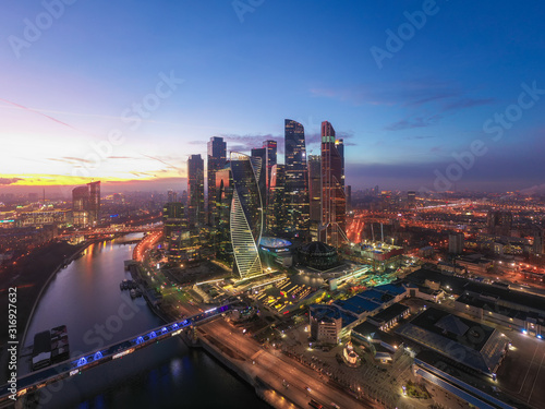 Moscow city sunset aerial view from drone with scyscrappers, business centre and ambankment