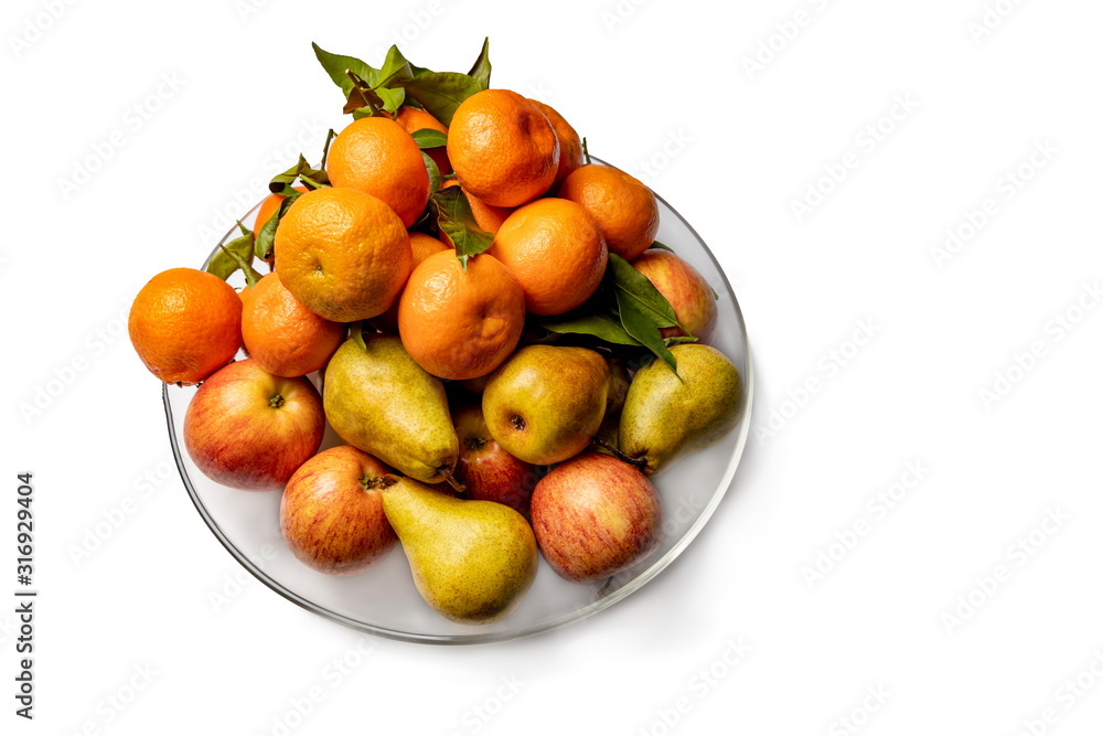 Apples, pears and tangerines in a plate isolated on a white background. Apples, pears and tangerines in a plate isolated on a white background.