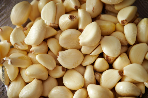 Peeled garlic background, studio shot 