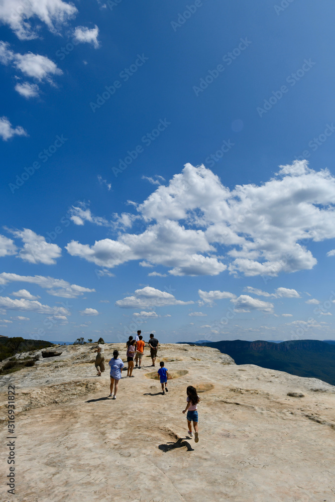 People walking on Lincoln's Rock at Wentworth Falls in the Blue Mountains west of Sydney