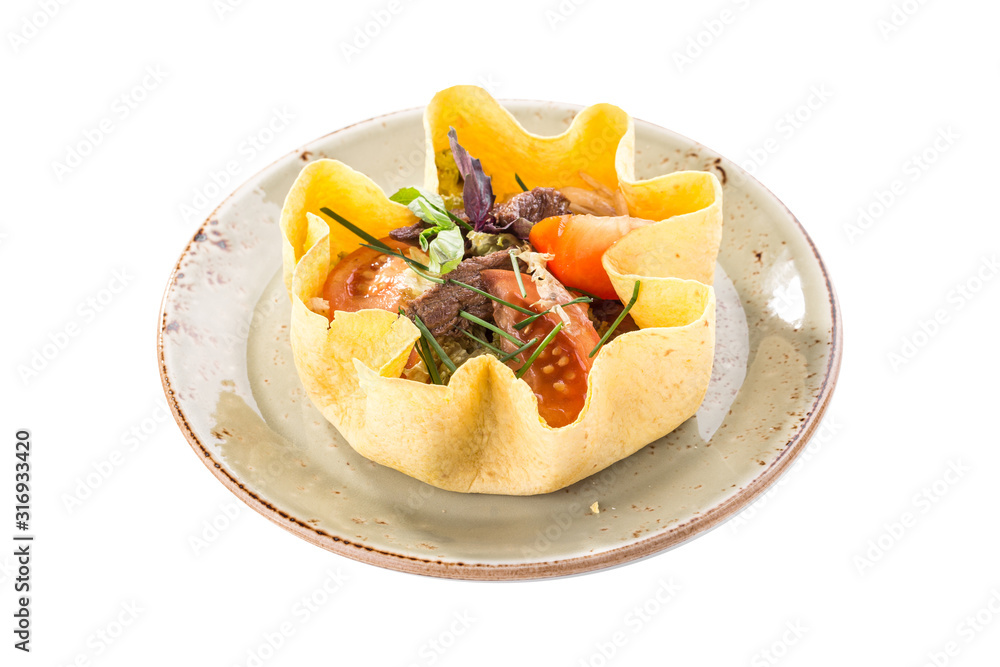 Beef salad with mixed vegetables served in tortilla bowl isolated on white background Beef salad with mixed vegetables served in tortilla bowl isolated on white background