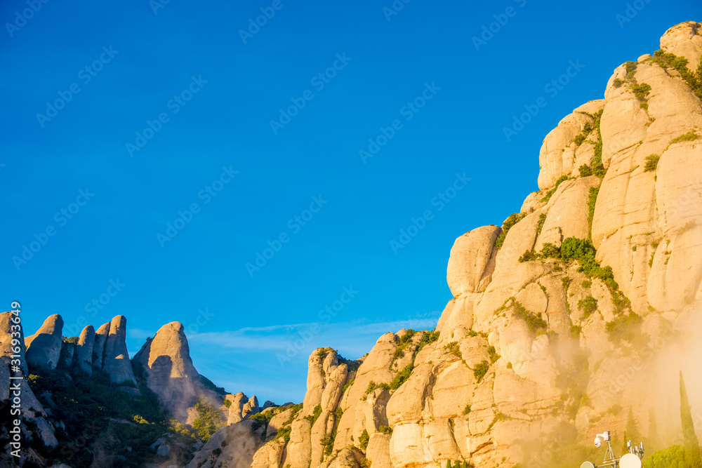 BARCELONA, SPAIN - December 26, 2018: The mountains of Montserrat in Barcelona, Spain. Montserrat  is a Spanish shaped mountain which influenced Antoni Gaudi to make his art works.