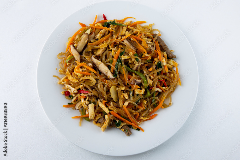 Stir fried Korean glass noodle with soy sauce called Japchae Stir fried Korean glass noodle with soy sauce called Japchae