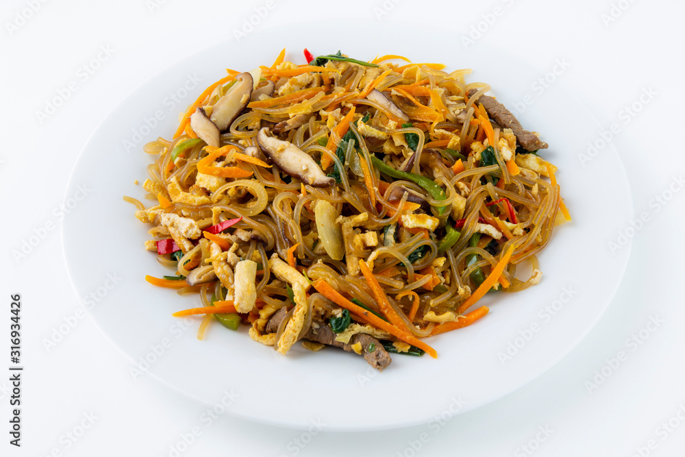 Stir fried Korean glass noodle with soy sauce called Japchae Stir fried Korean glass noodle with soy sauce called Japchae