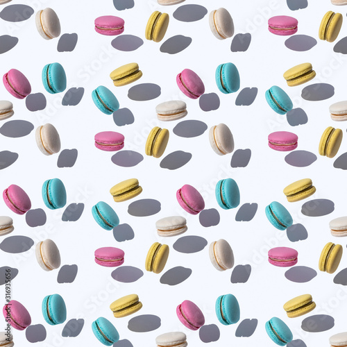 Pattern with flying macaroons in abstract style on colorful background. Magic surreal concept. Minimal fashion modern summer concept.