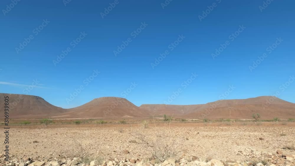 4x4 Drive On Namibias Gravel Roads - Side View 4x4 Drive On Namibias Gravel Roads - Side View