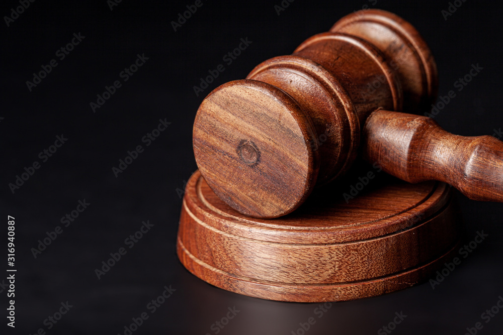 Wooden judges gavel on table close up Wooden judges gavel on table close up