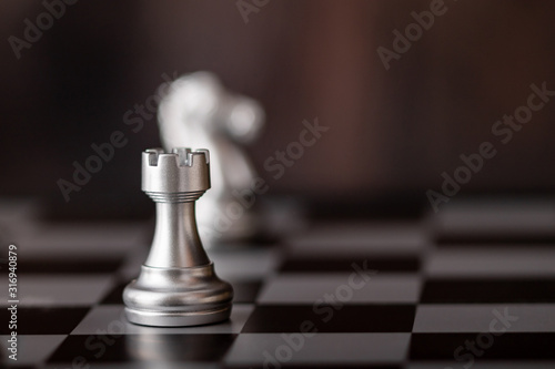 Silver chess on the board