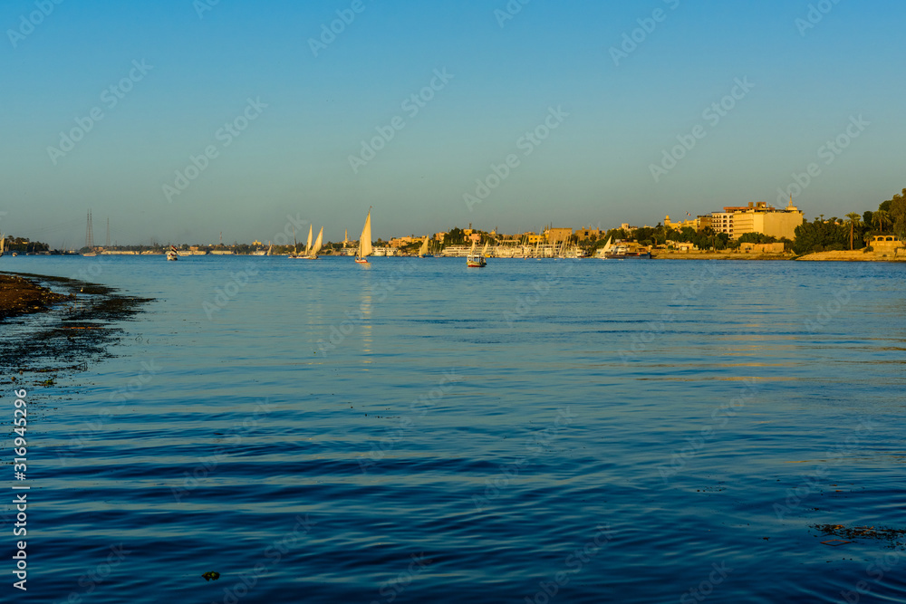 Different vessels on the Nile river in Luxor, Egypt.