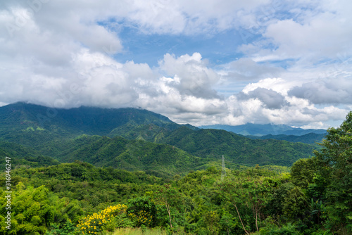 beautiful blue sky high peak mountains mist fog wildlife green forest at Khao Koh, Phu Tub Berk, Phetchabun, Thailand guiding idea long weekend for backpacker camping campfire relaxing hiking