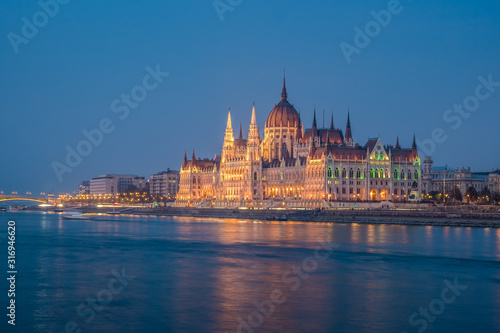 Hungarian Parliament building and Danube River in the Budapest city in the evening. A sample of neo-gothic architecture. © k_samurkas