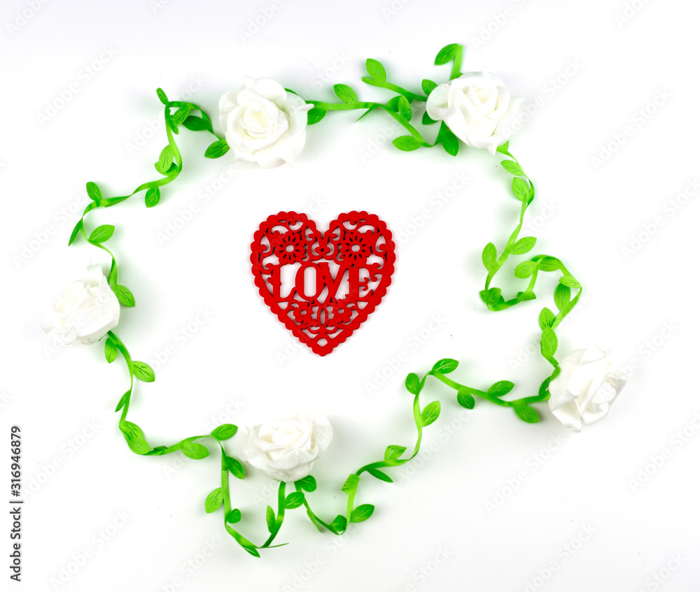 red heart shape which engrave into letter love in white rose vine frame on white background, image for valentine and wedding concept
