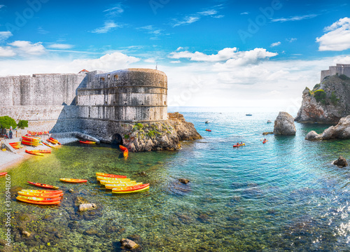 Fototapeta Naklejka Na Ścianę i Meble -  Fort Bokar and Fort Lovrijenac on a sunny day with kayaks at sea
