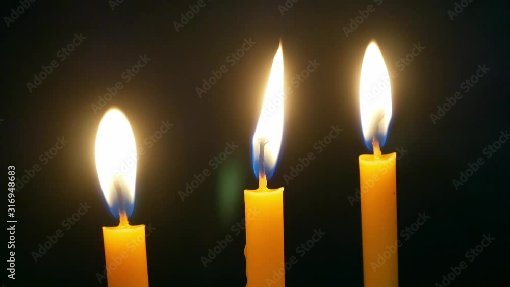 Candle light moving on dark background. Candle light moving on dark background.