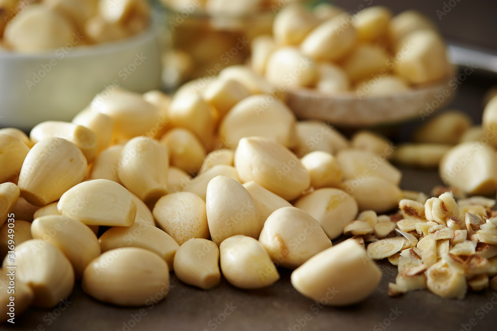 Peeled garlic background, studio shot Peeled garlic background, studio shot