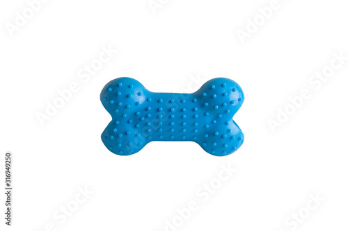 Durable blue rubber dog's bone isolated on white background, puppy dog toy imitated bones for relax. Fetching, tugging, molar tooth cleaning and safety chewing for pup entertained.Close up, copy space