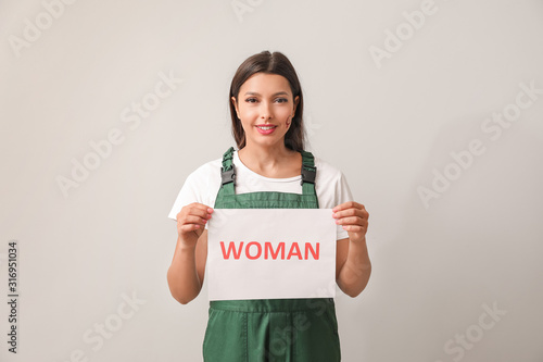 Female worker holding paper...