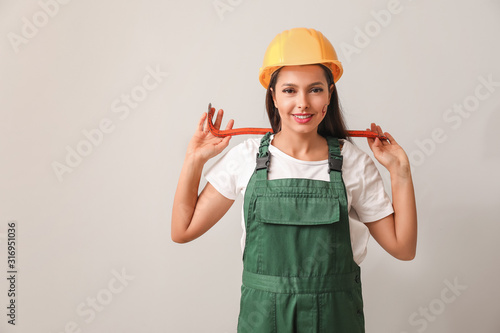 Female worker on light back...