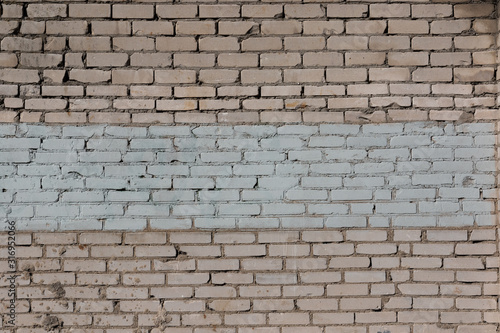 texutre of a brick wall with a white painted band