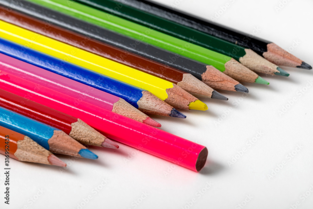 close up macro shot of colorful pencils on white background close up macro shot of colorful pencils on white background
