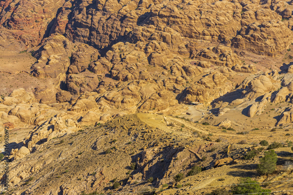 Vintage photos from archive. Road to Sik gorge leading to ancient city of Petra. Between steep cliffs, pedestrian road is laid to entrance to Sik Gorge. Panorama.