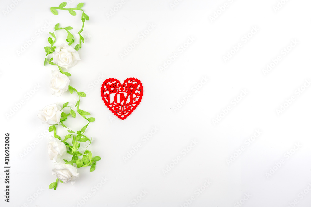 red heart shape which engrave into letter love in white rose vine frame , image for valentine and wedding concept red heart shape which engrave into letter love in white rose vine frame , image for valentine and wedding concept