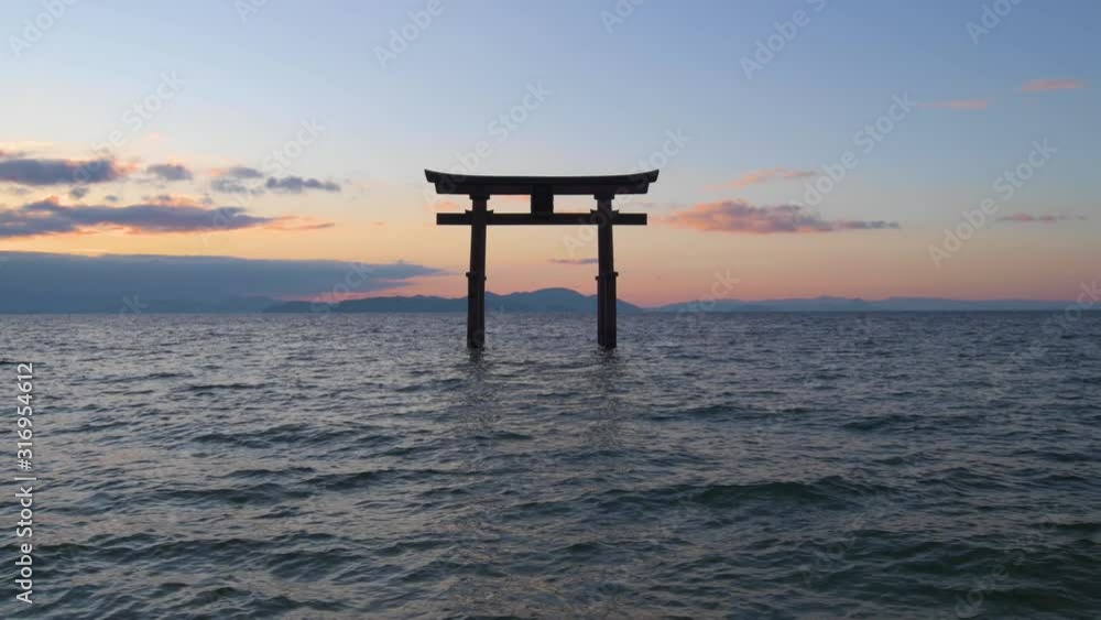 Sunrise at Shirahige shrine torii gate, lake Biwa, Shiga Prefecture, Japan Sunrise at Shirahige shrine torii gate, lake Biwa, Shiga Prefecture, Japan