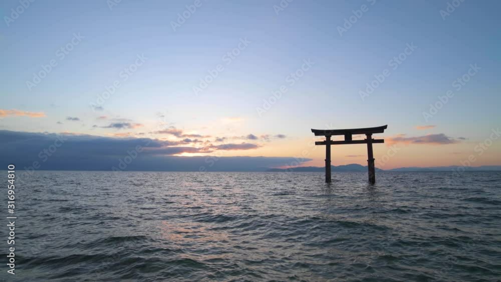 Sunrise at Shirahige shrine torii gate, lake Biwa, Shiga Prefecture, Japan Sunrise at Shirahige shrine torii gate, lake Biwa, Shiga Prefecture, Japan