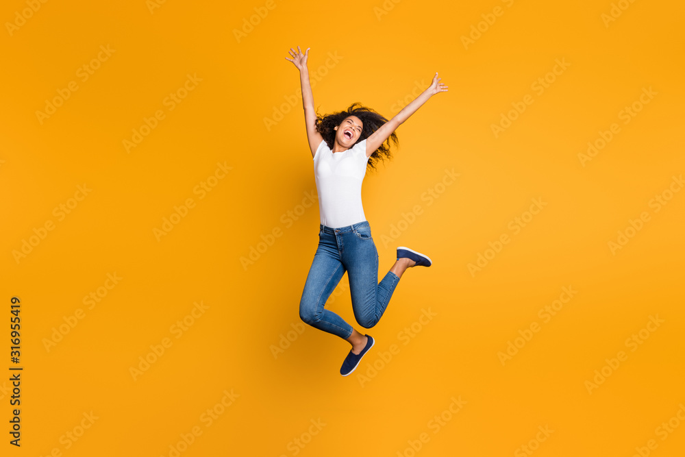 Full length body size view of her she nice attractive crazy cheerful wavy-haired girl jumping motivation having fun inspiration isolated over bright vivid shine vibrant yellow color background