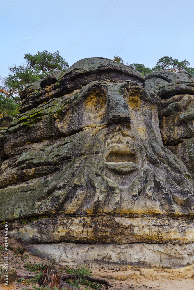 Sculptures Devil's heads in the village Zelizy - Czech republic