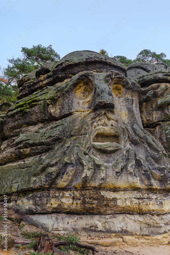 Sculptures Devil's heads in the village Zelizy - Czech republic Sculptures Devil's heads in the village Zelizy - Czech republic