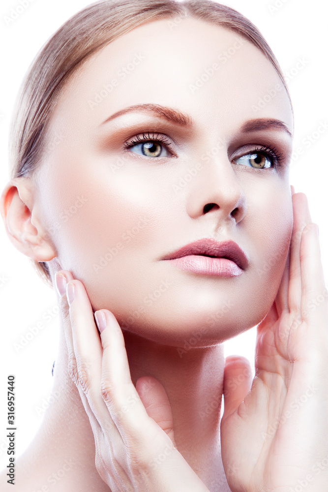 Close-up beauty portrait of young model woman with perfect skin touching face apply cream cosmetics. Skincare facial treatment concept Close-up beauty portrait of young model woman with perfect skin touching face apply cream cosmetics. Skincare facial treatment concept