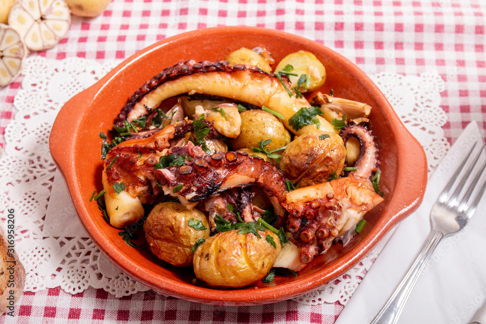 Grilled ocotpus with potatoes, garlic and salsa. Grilled ocotpus with potatoes, garlic and salsa.
