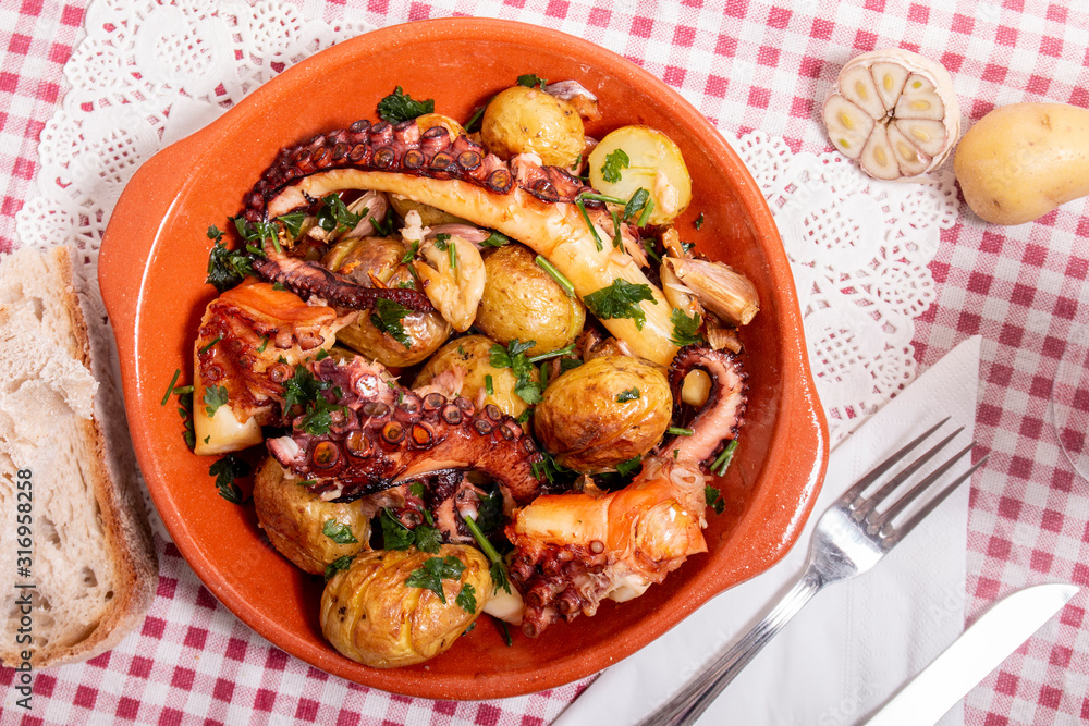 Grilled ocotpus with potatoes, garlic and salsa. Grilled ocotpus with potatoes, garlic and salsa.