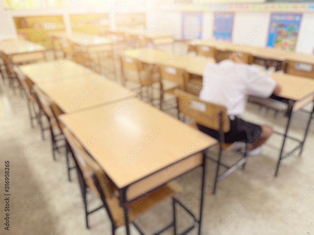 blurred image of one student sleeping in classroom blurred image of one student sleeping in classroom